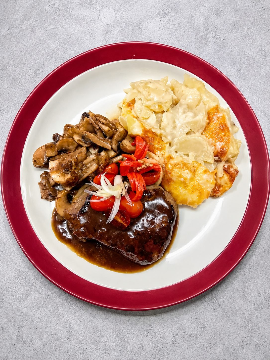 Fillet mignon with mushrooms, cherry tomatoes and gratin potatoes at The Dining Room Candidasa