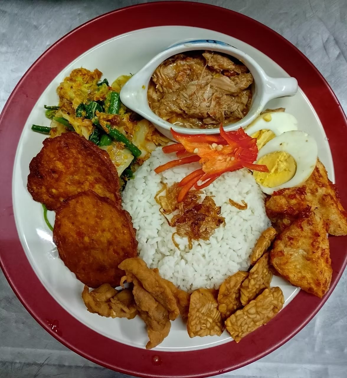 Nasi campur with fried chicken, tempeh and sambal at The Dining Room Candidasa
